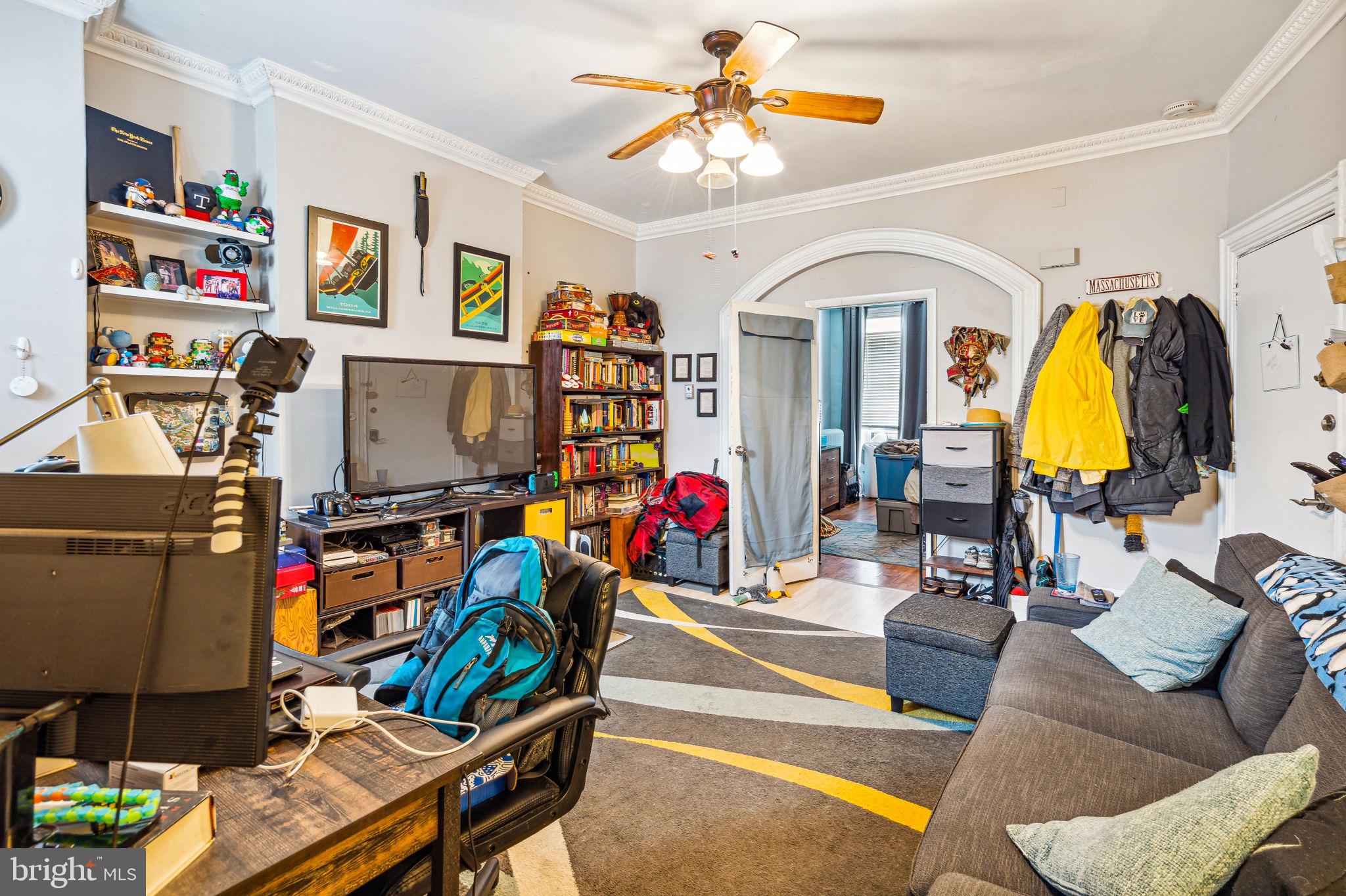 129 Gay Street, Unit 1 Philadelphia, PA 19127 - Photo 12 of 23 a living room with furniture and a gym equipment