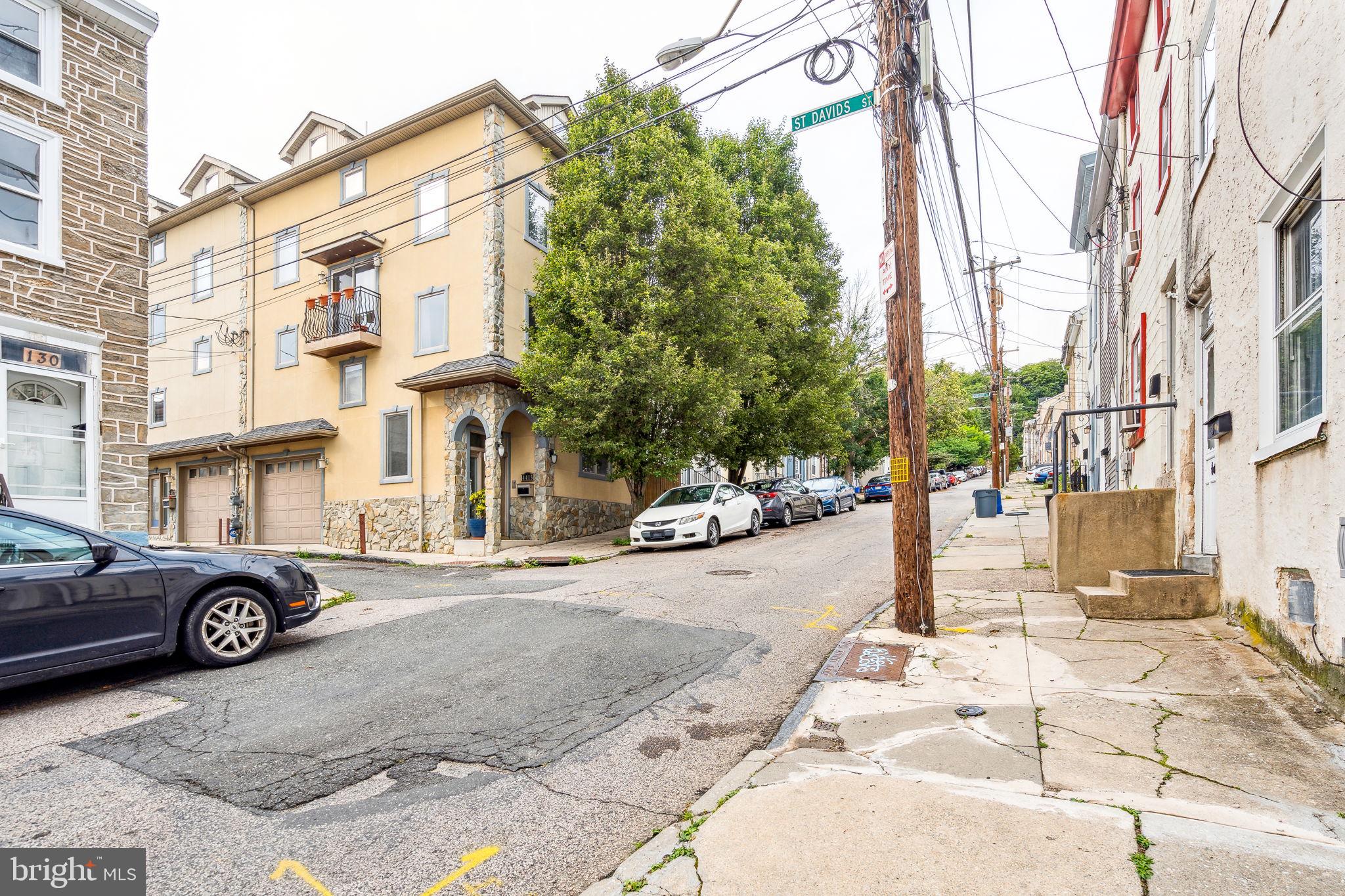 129 Gay Street, Unit 1 Philadelphia, PA 19127 - Photo 5 of 23 a street view with building and car parked on the road