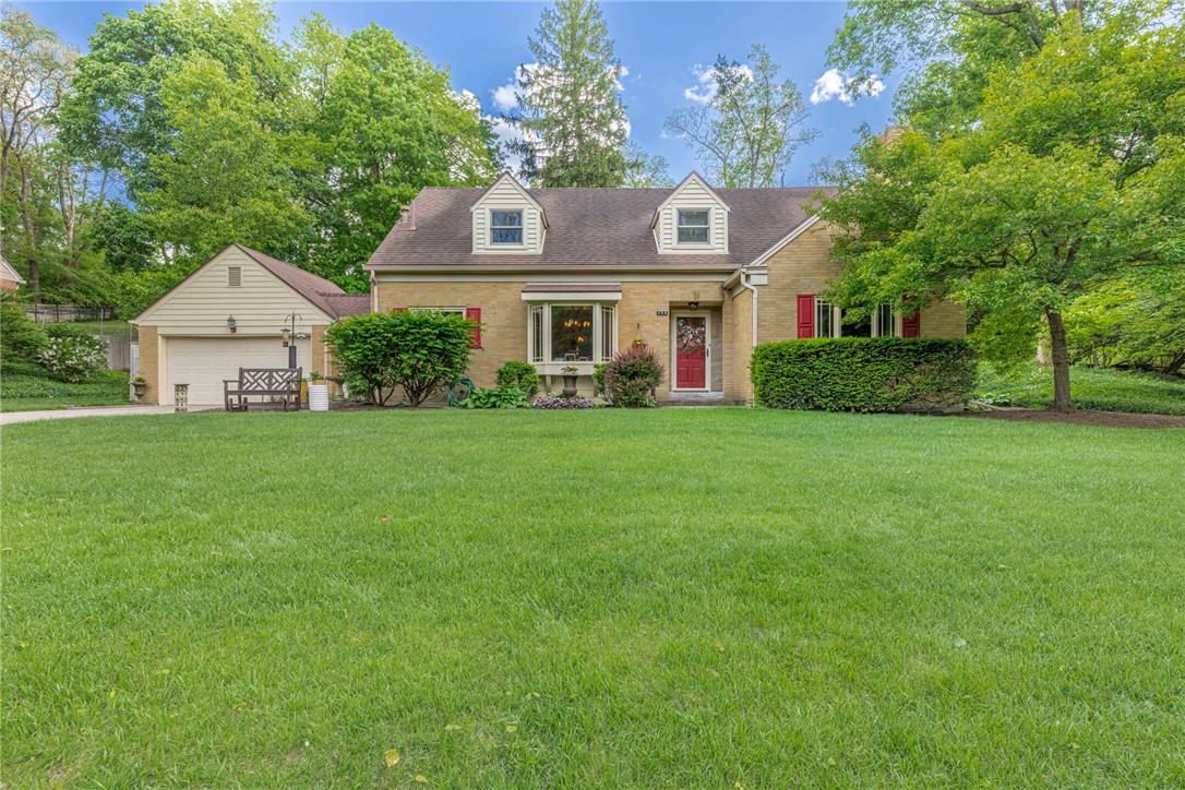 156 West Hadley Road Dayton, OH 45419 - Photo 1 of 71 This charming residence features dormer windows, a bay window, and an attached garage, set amidst lush green landscaping.