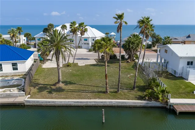 a view of a swimming pool with a yard