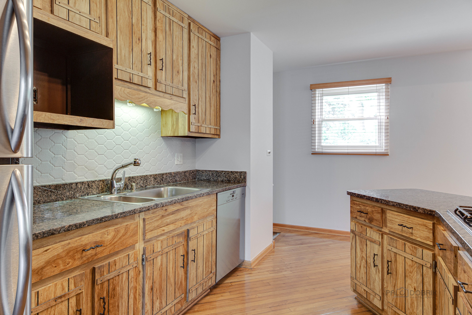 9747 Huber Ovl Niles, IL 60714 - Photo 16 of 38 a kitchen with stainless steel appliances granite countertop a sink stove and microwave