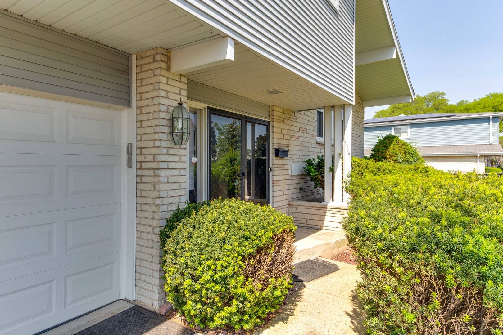 9747 Huber Ovl Niles, IL 60714 - Photo 2 of 38 a view of yellow house with a yard