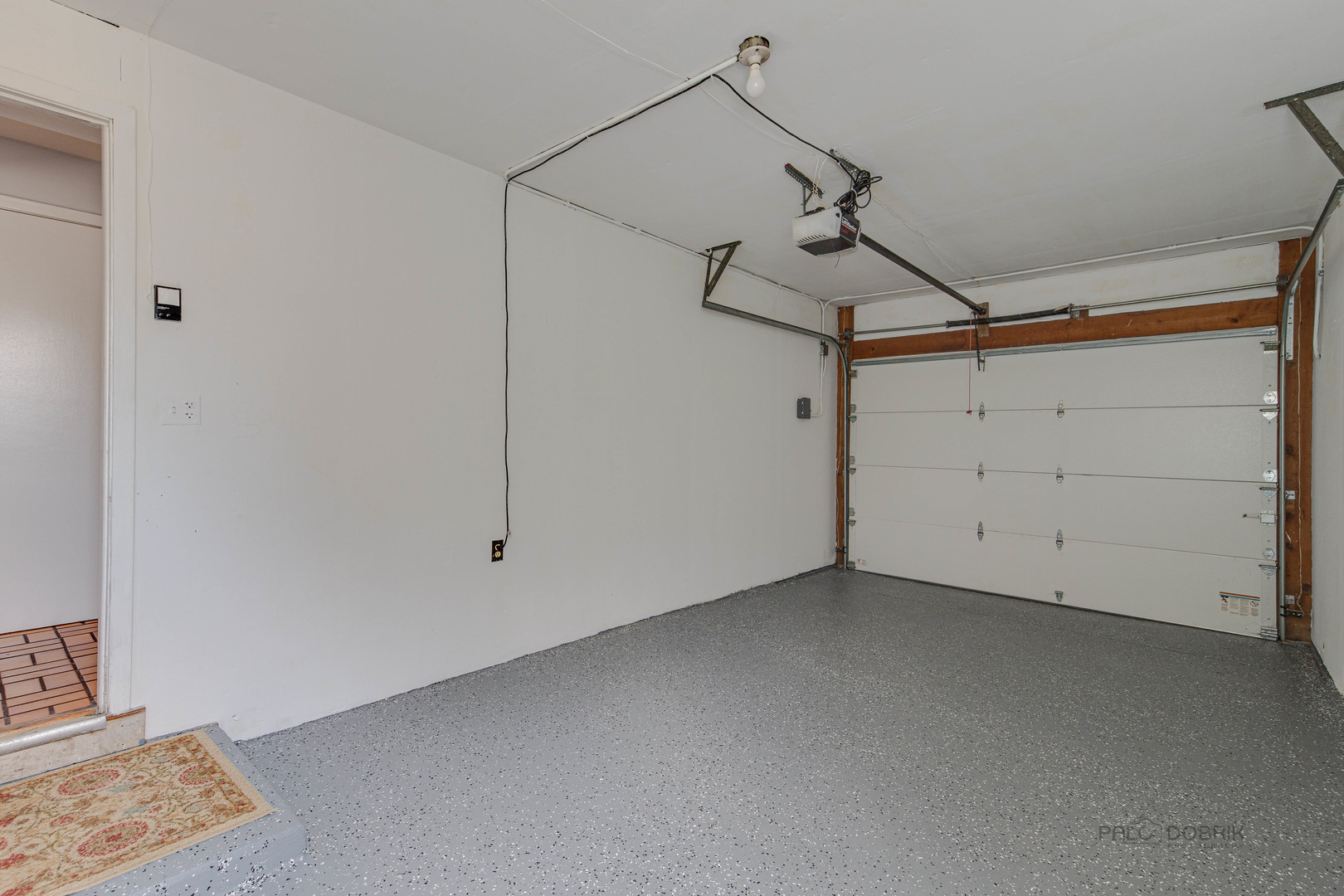 9747 Huber Ovl Niles, IL 60714 - Photo 36 of 38 a view of a room with rack and wooden floor