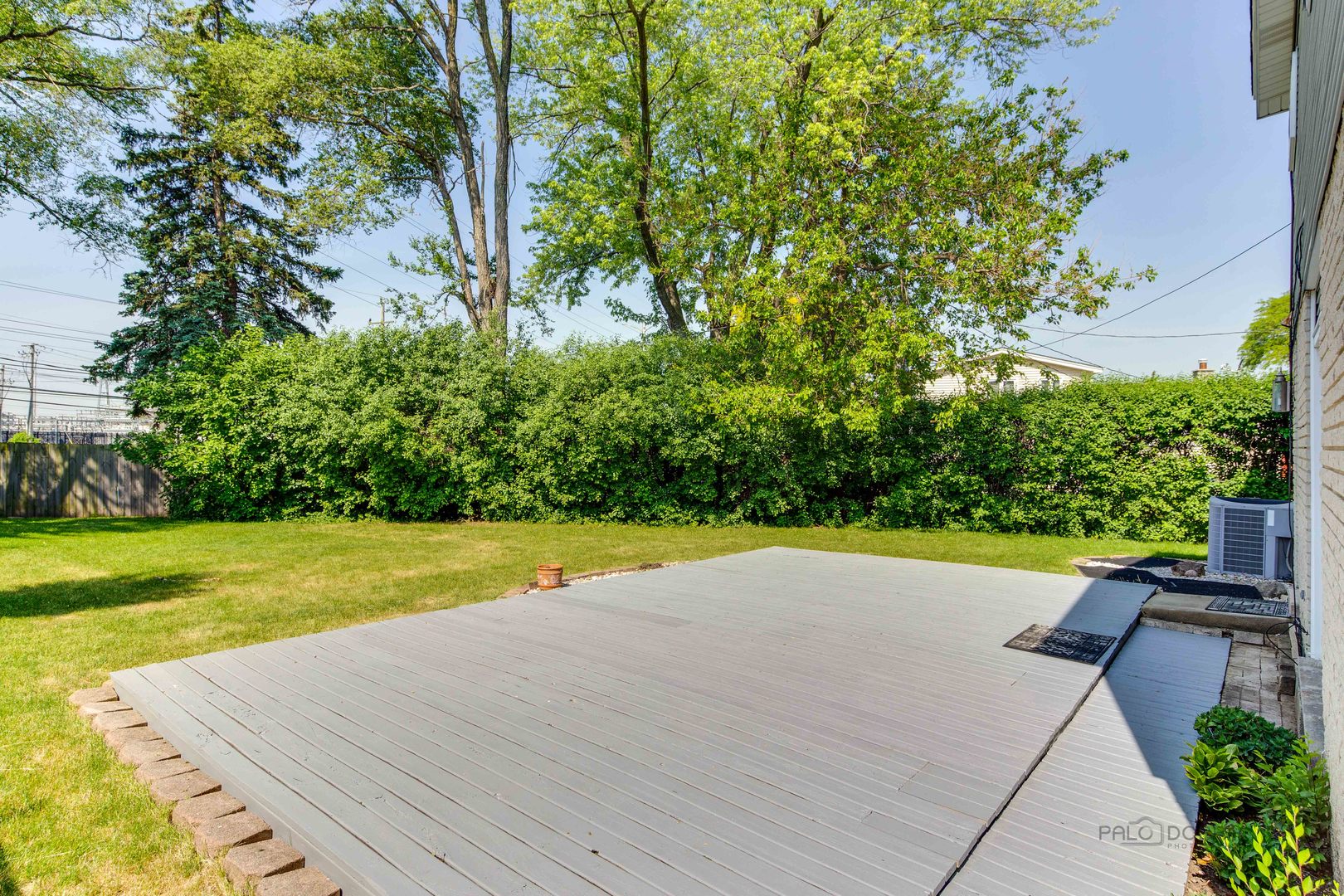 9747 Huber Ovl Niles, IL 60714 - Photo 37 of 38 a view of a swimming pool and a yard