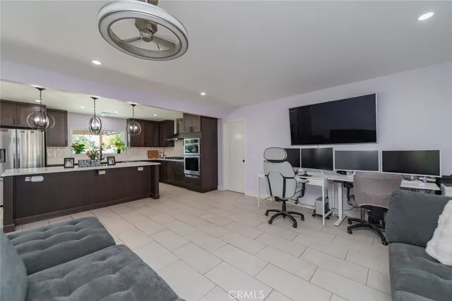 a kitchen with a sink stainless steel appliances and cabinets