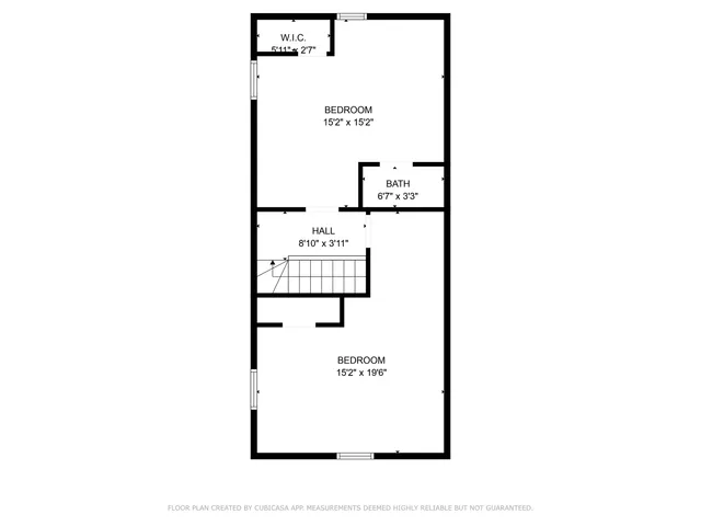 a picture of a bench in front of a wall