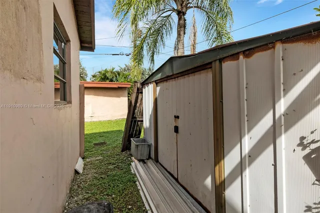 a view of a back yard from a balcony