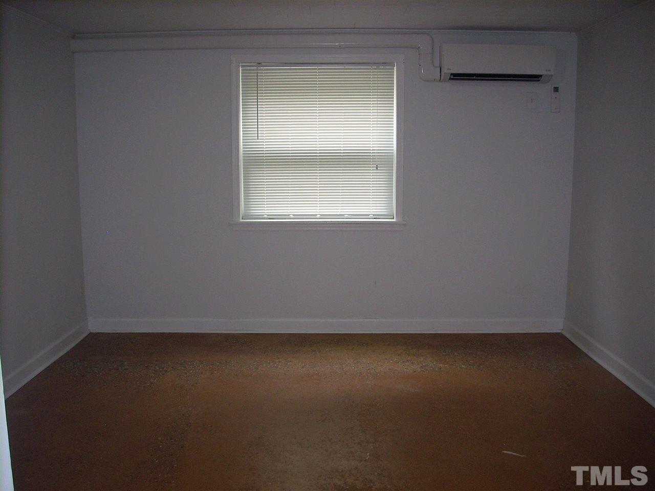 2715 Campbell Road, Unit B Raleigh, NC 27606 - Photo 11 of 25 an empty room with a window