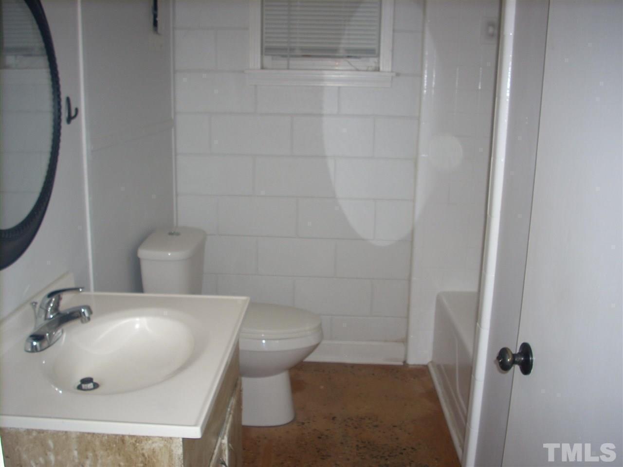 2715 Campbell Road, Unit B Raleigh, NC 27606 - Photo 12 of 25 a bathroom with a sink and a toilet