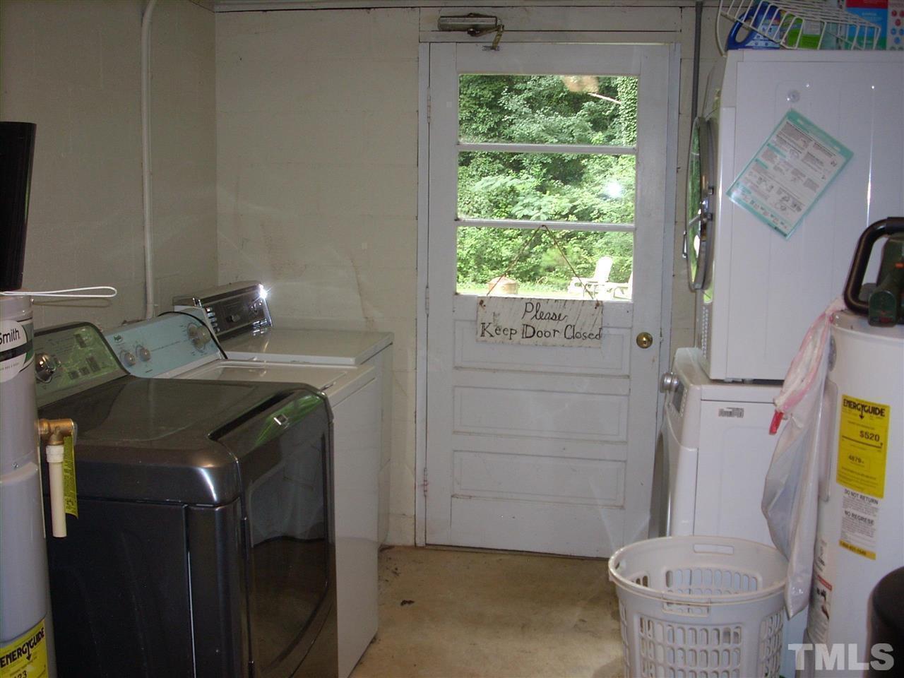 2715 Campbell Road, Unit B Raleigh, NC 27606 - Photo 15 of 25 a bathroom with a sink a toilet and shower
