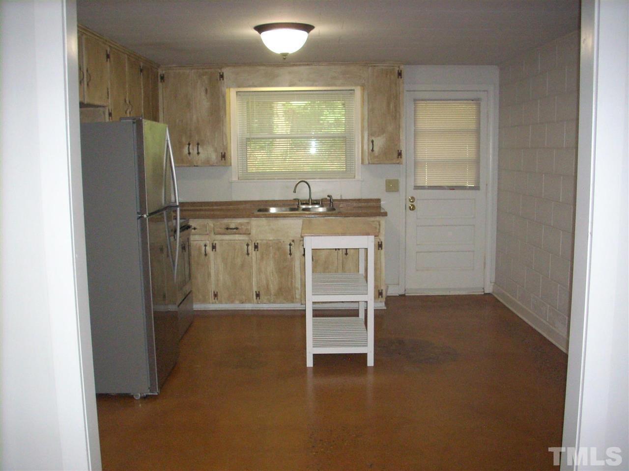 2715 Campbell Road, Unit B Raleigh, NC 27606 - Photo 6 of 25 a view of kitchen with furniture and refrigerator