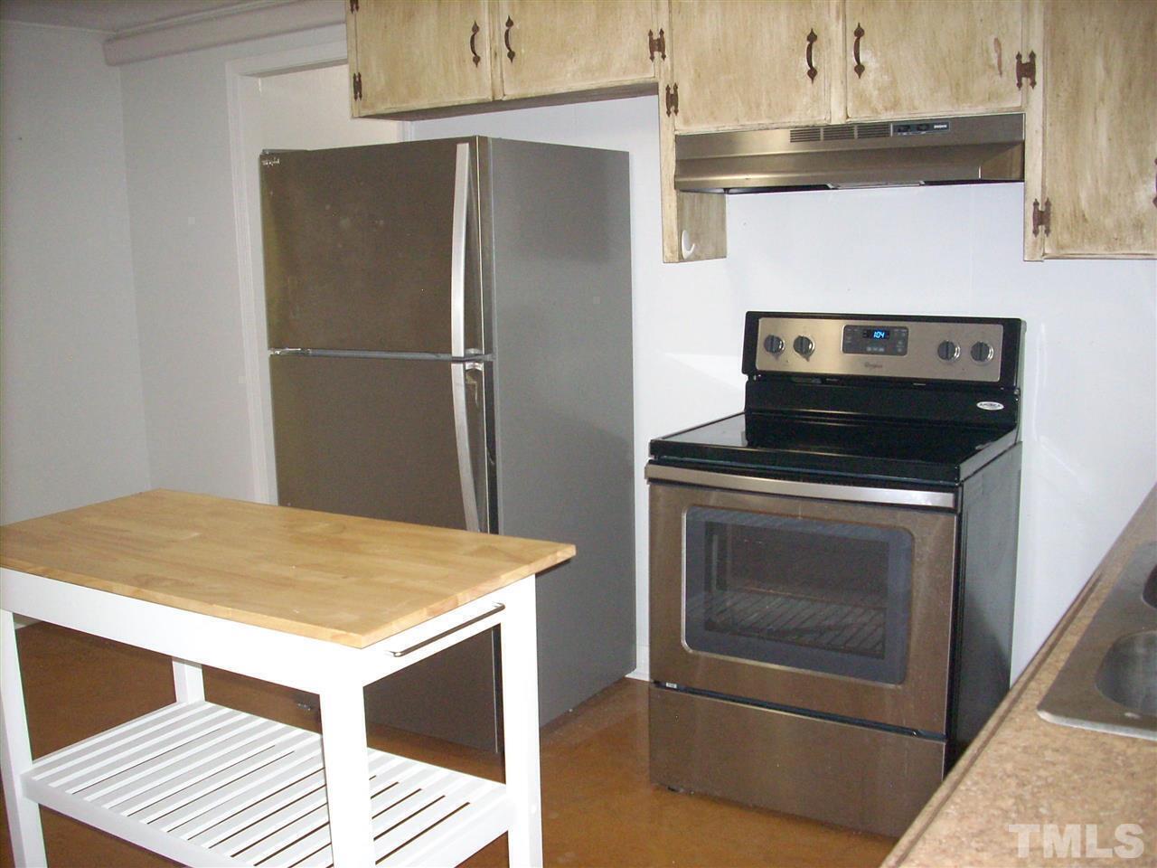 2715 Campbell Road, Unit B Raleigh, NC 27606 - Photo 8 of 25 a kitchen with a stove and a refrigerator
