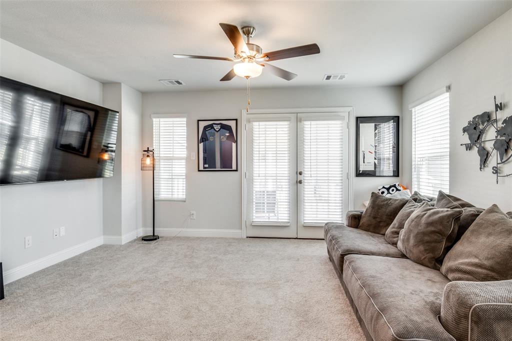 8413 Alba Lane Rowlett, TX 75089 - Photo 21 of 25 Living room with light carpet, ceiling fan, and french doors