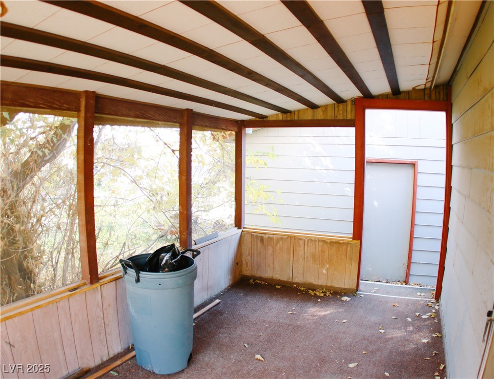 31 South 4th Street Panaca, NV 89042 - Photo 12 of 36 Unfurnished sunroom featuring lofted ceiling