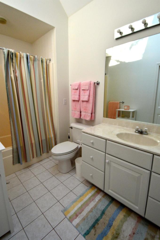 216 Riverview Lane Centerville, MA 02632 - Photo 12 of 16 a bathroom with a double vanity sink mirror and toilet