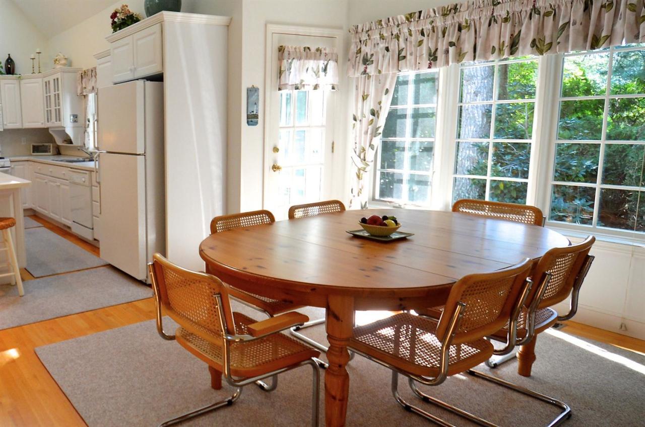 216 Riverview Lane Centerville, MA 02632 - Photo 8 of 16 a view of a dining room with furniture and window