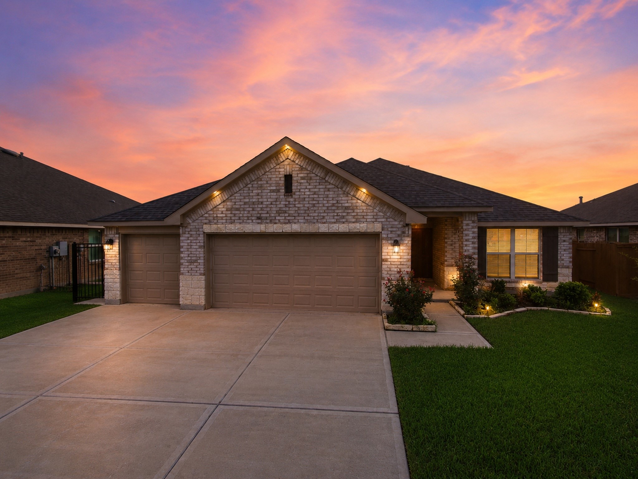 10142 Whitney Reach Drive Rosharon, TX 77583 - Photo 1 of 26 a front view of a house with a yard and garage