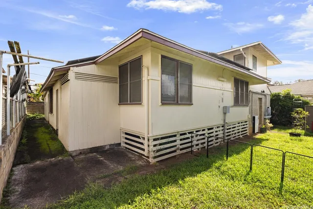 a view of a backyard with a patio and plants