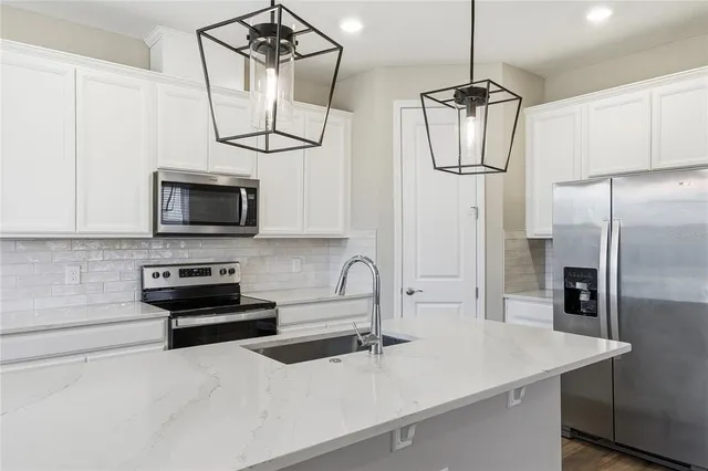 a bathroom with a sink mirror and toilet