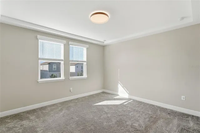 a white toilet sitting next to a shower