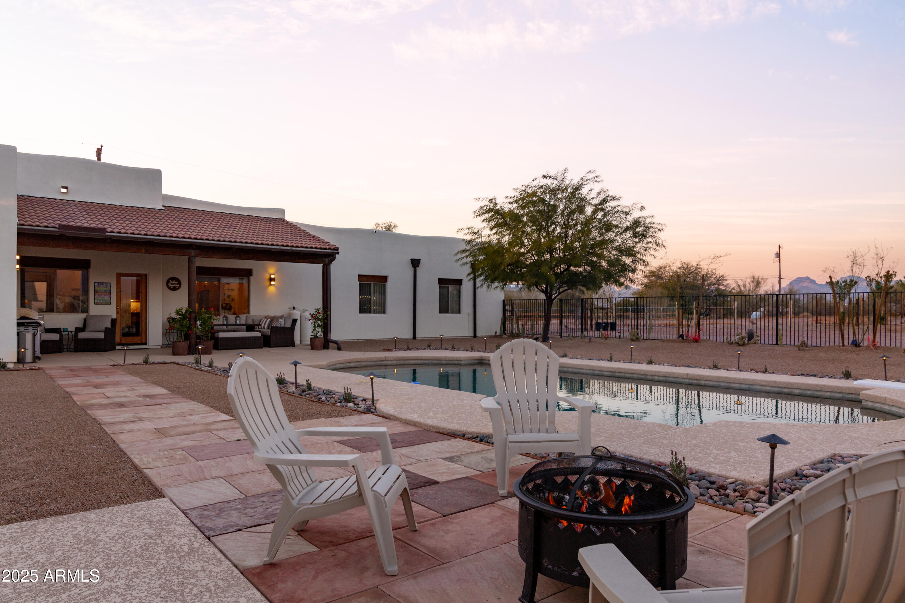 1775 North Starr Road Apache Junction, AZ 85119 - Photo 12 of 48 a view of a roof deck with couches and potted plants