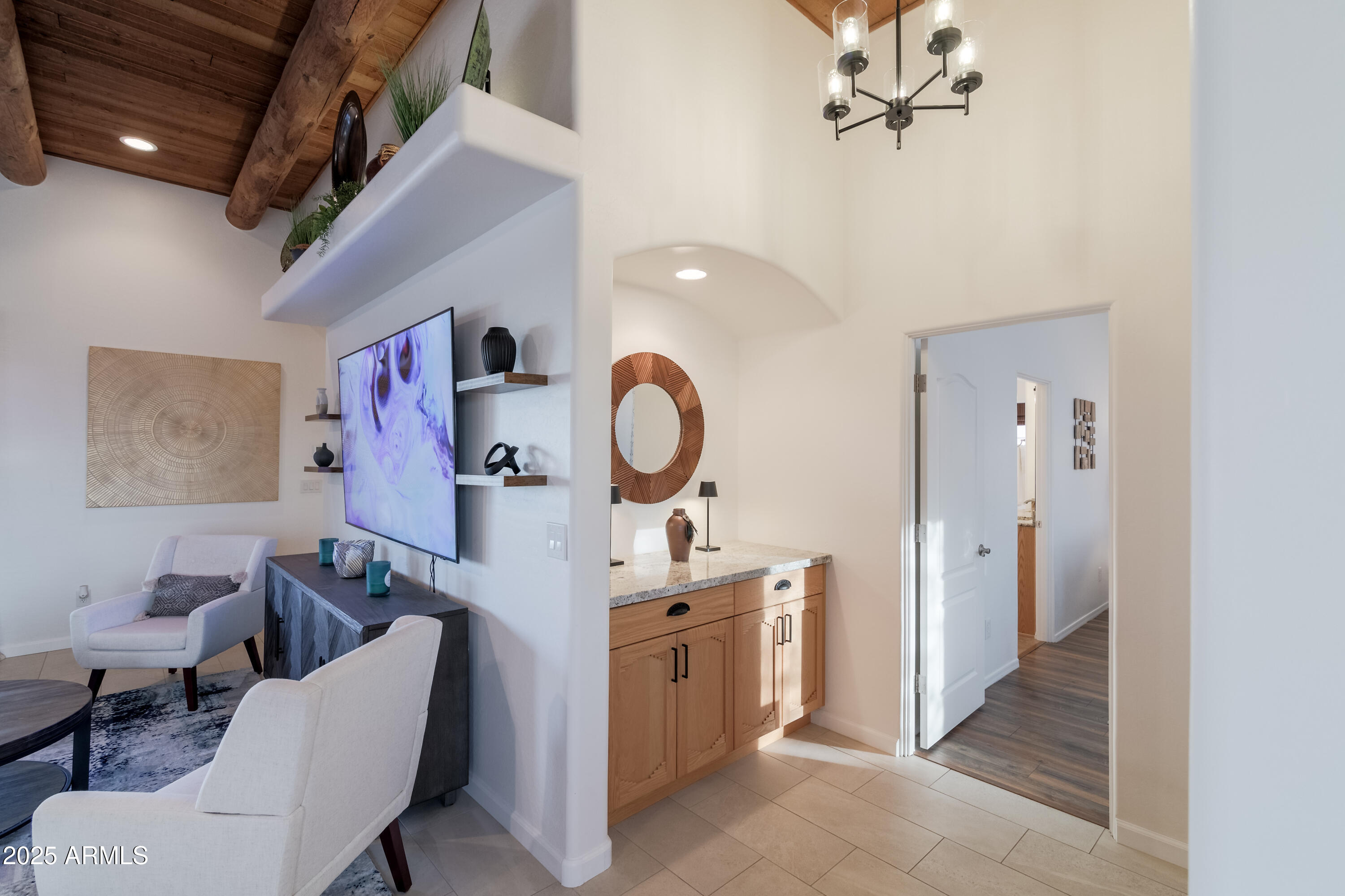1775 North Starr Road Apache Junction, AZ 85119 - Photo 18 of 48 a room with a chair and white cabinets