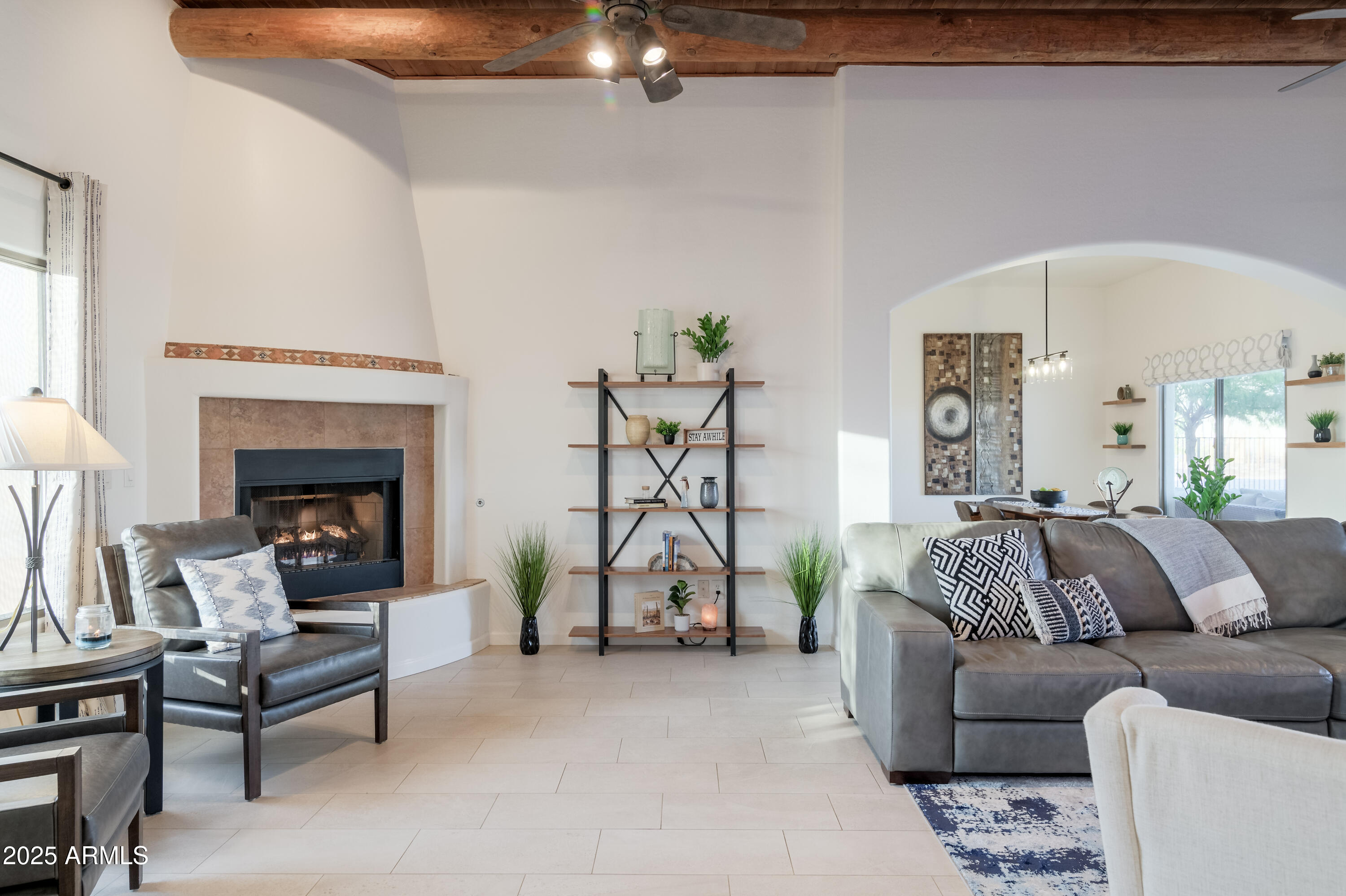 1775 North Starr Road Apache Junction, AZ 85119 - Photo 21 of 48 a living room with furniture a fireplace and a chandelier