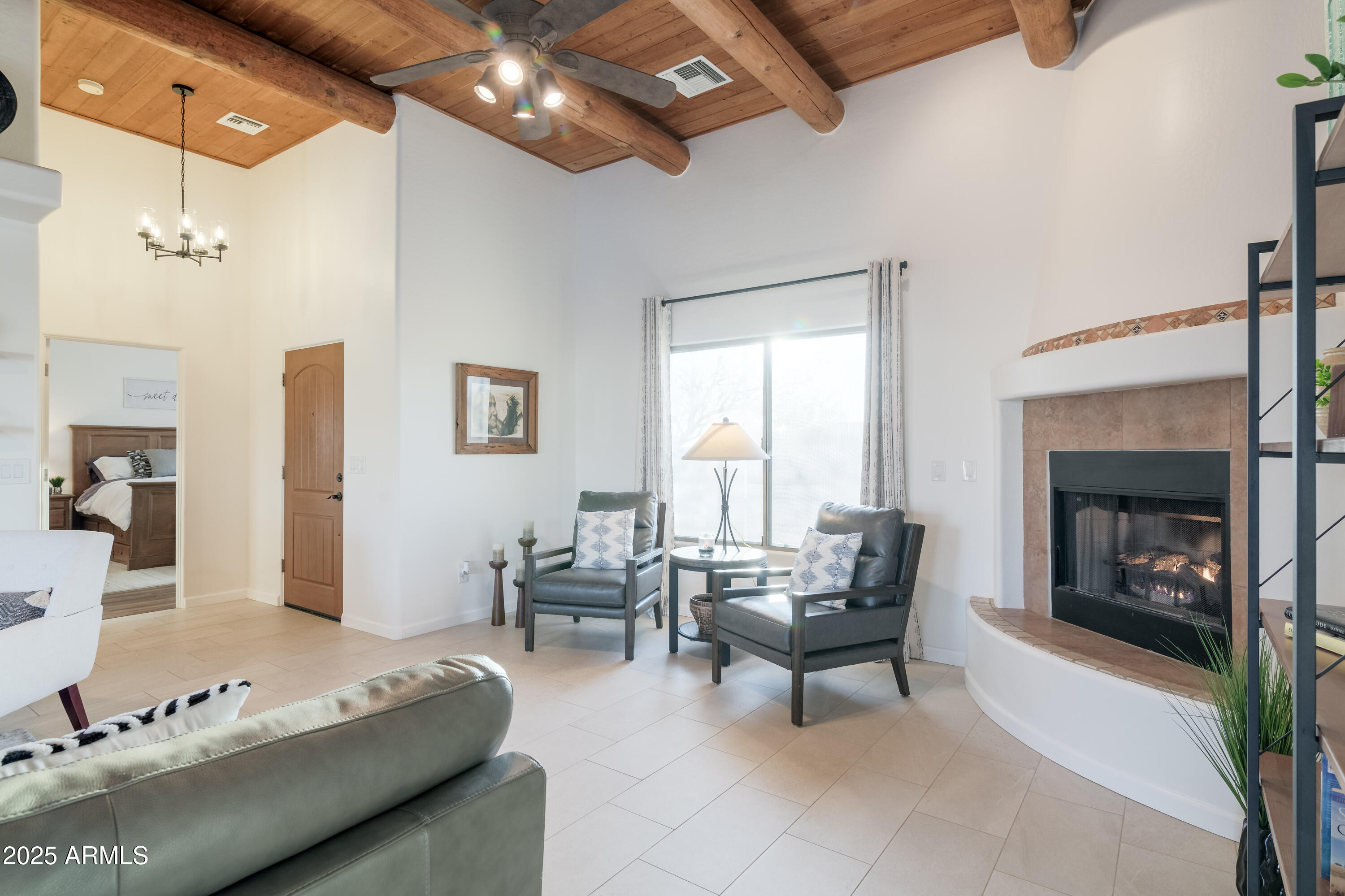 1775 North Starr Road Apache Junction, AZ 85119 - Photo 22 of 48 a living room with furniture and a fireplace