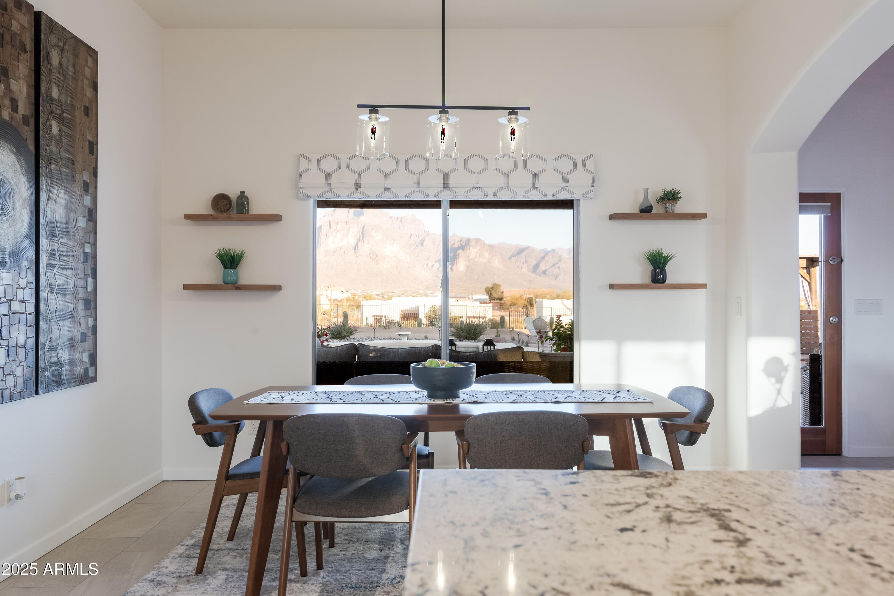 1775 North Starr Road Apache Junction, AZ 85119 - Photo 25 of 48 a kitchen with a table chairs stove and kitchen view