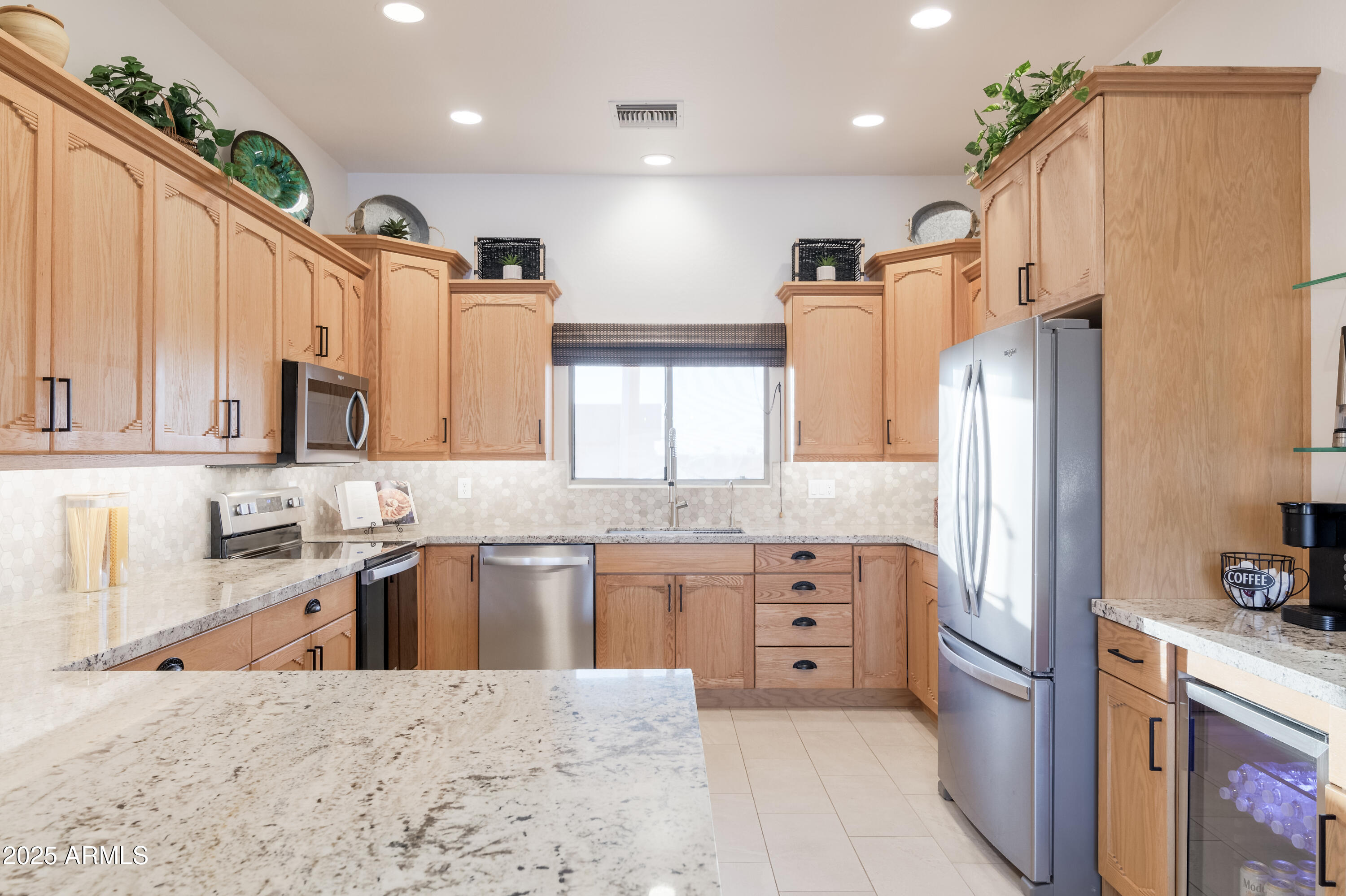 1775 North Starr Road Apache Junction, AZ 85119 - Photo 27 of 48 a kitchen with granite countertop a sink stove and refrigerator