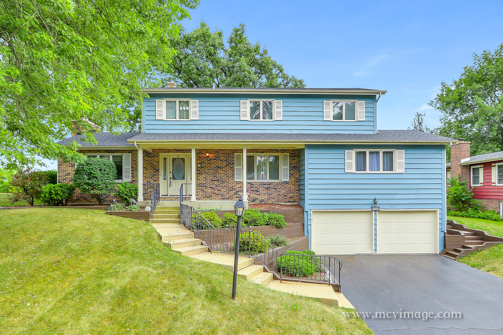 359 High Road Cary, IL 60013 - Photo 1 of 32 a front view of a house with a yard and porch