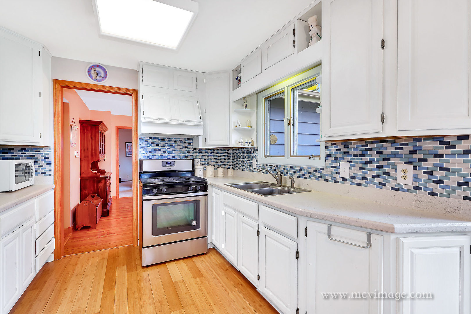 359 High Road Cary, IL 60013 - Photo 12 of 32 a kitchen with granite countertop a sink and a stove top oven