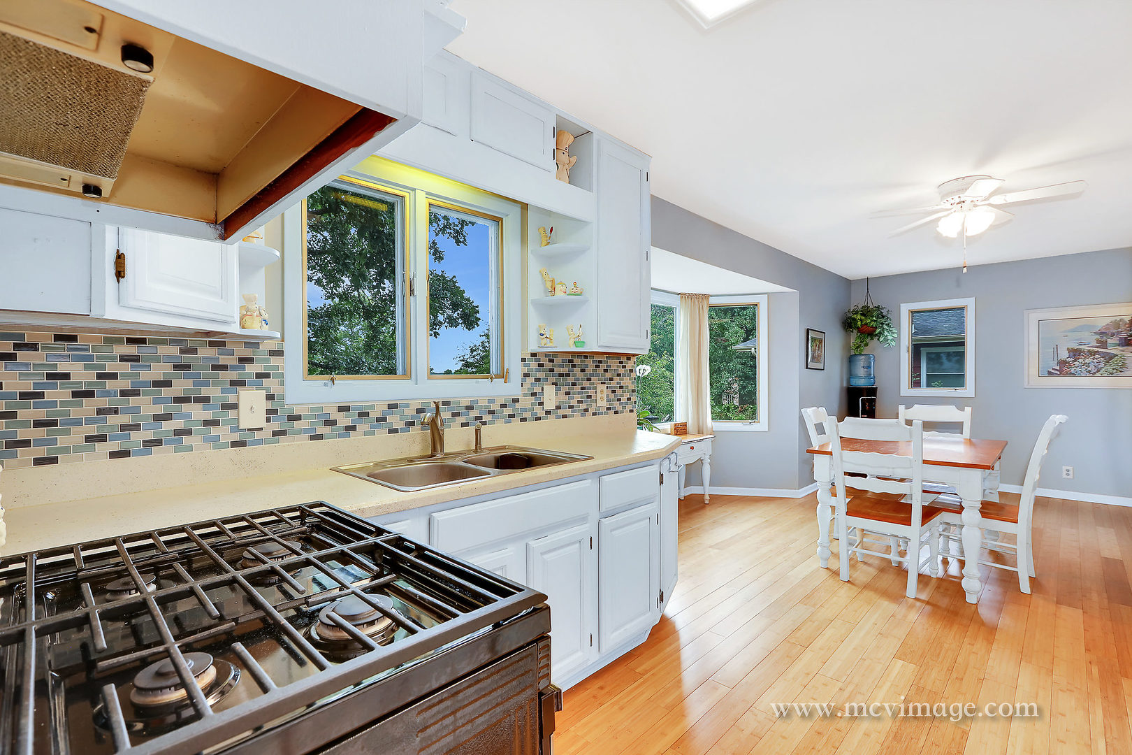 359 High Road Cary, IL 60013 - Photo 13 of 32 a kitchen with a sink and a stove top oven