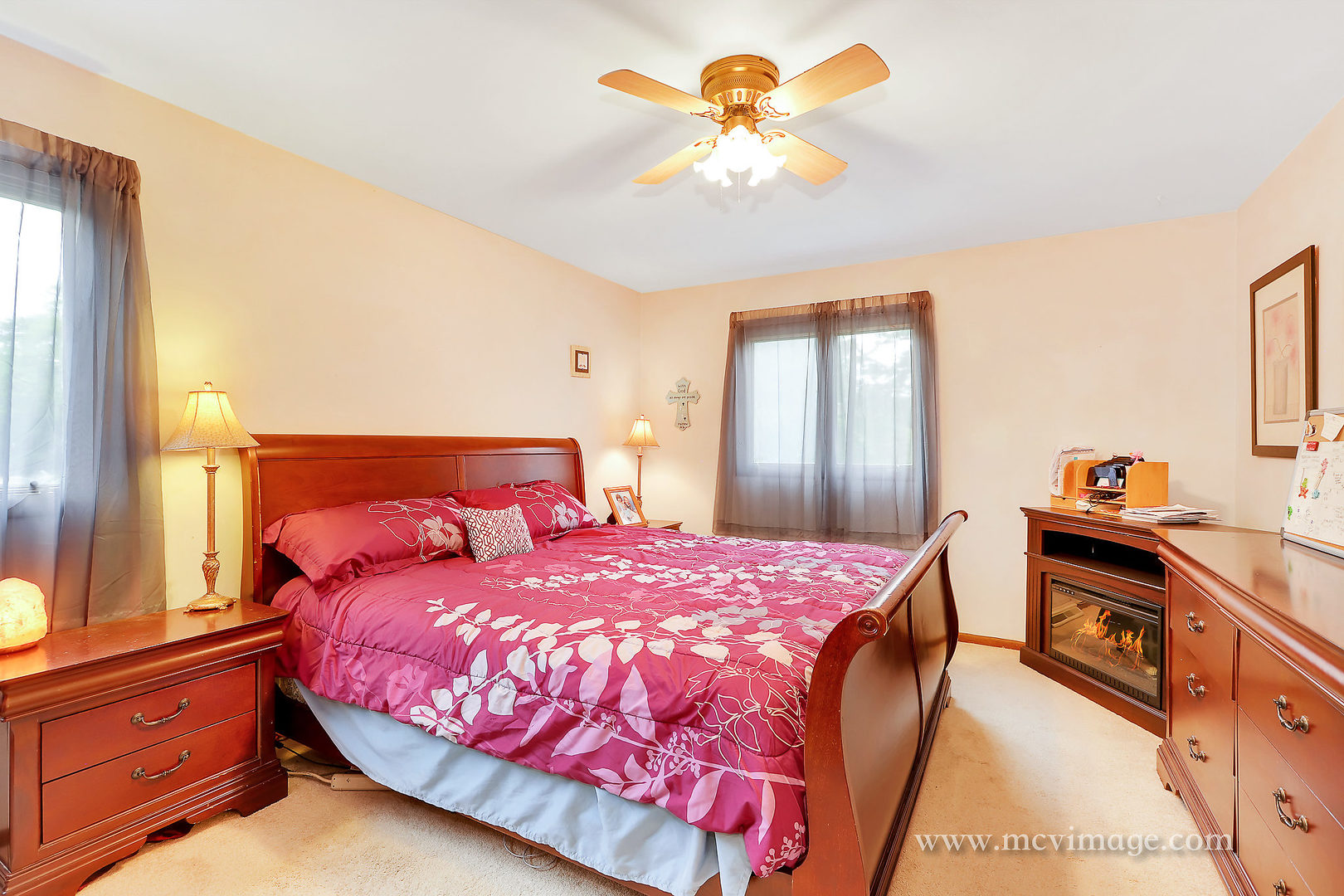 359 High Road Cary, IL 60013 - Photo 22 of 32 a bedroom with a bed and a chandelier
