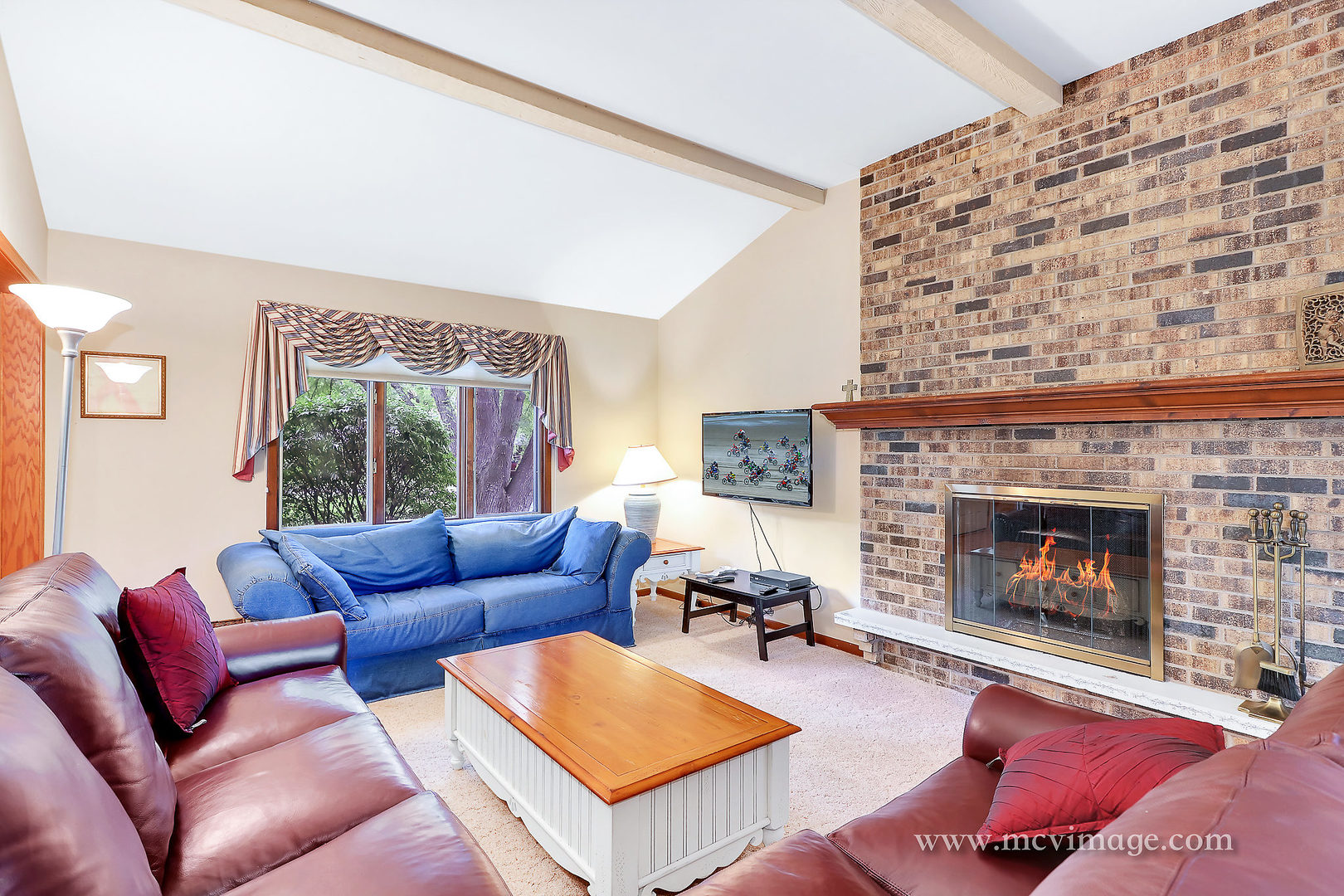 359 High Road Cary, IL 60013 - Photo 6 of 32 a living room with furniture and a fireplace