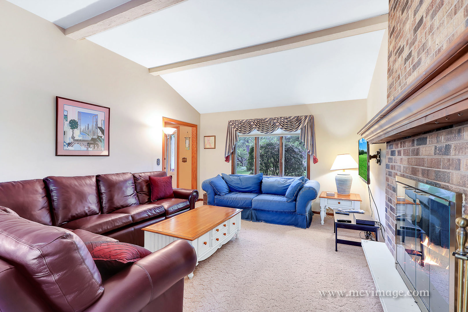 359 High Road Cary, IL 60013 - Photo 7 of 32 a living room with furniture and a fireplace