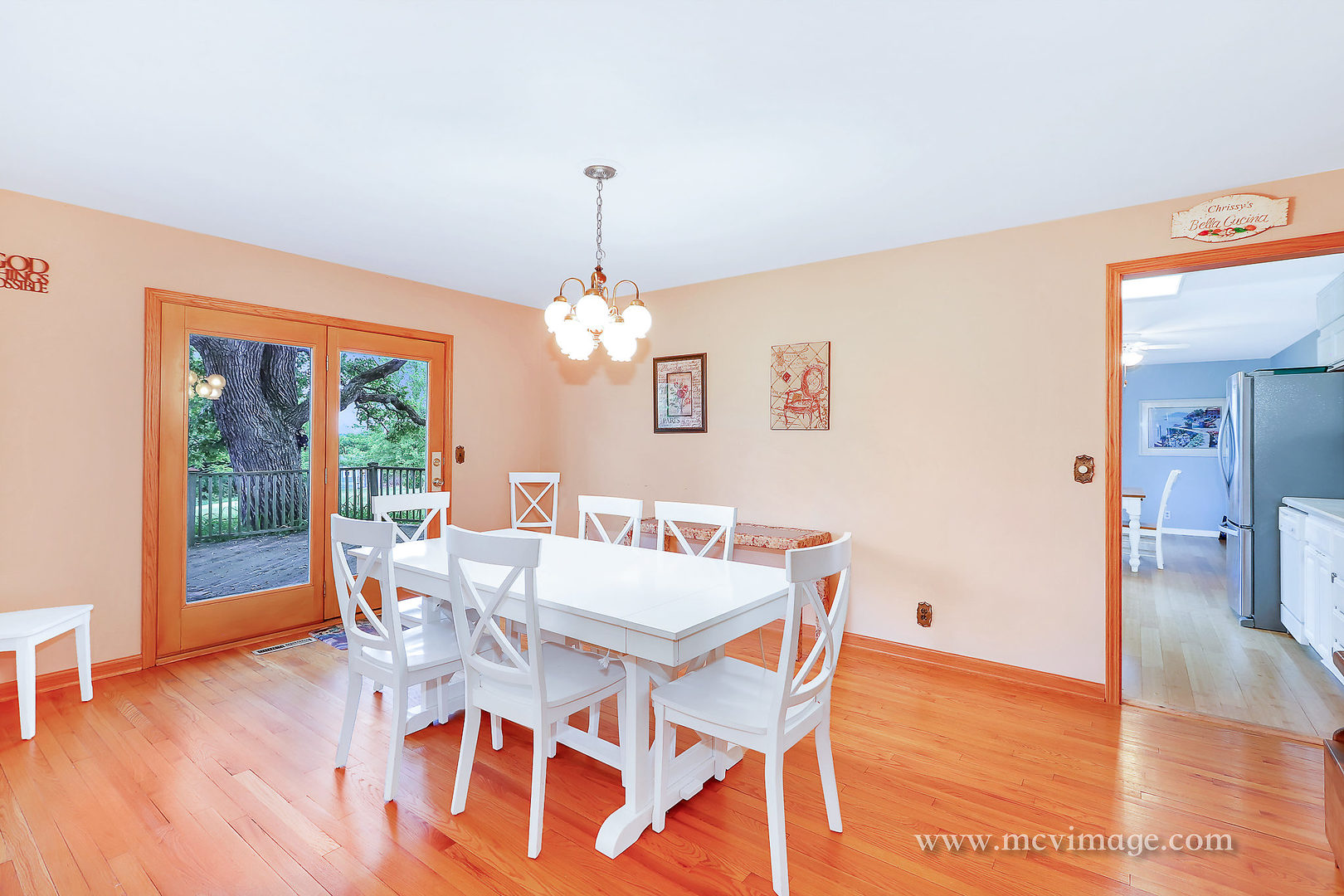 359 High Road Cary, IL 60013 - Photo 8 of 32 a view of a dining room with furniture wooden floor and chandelier