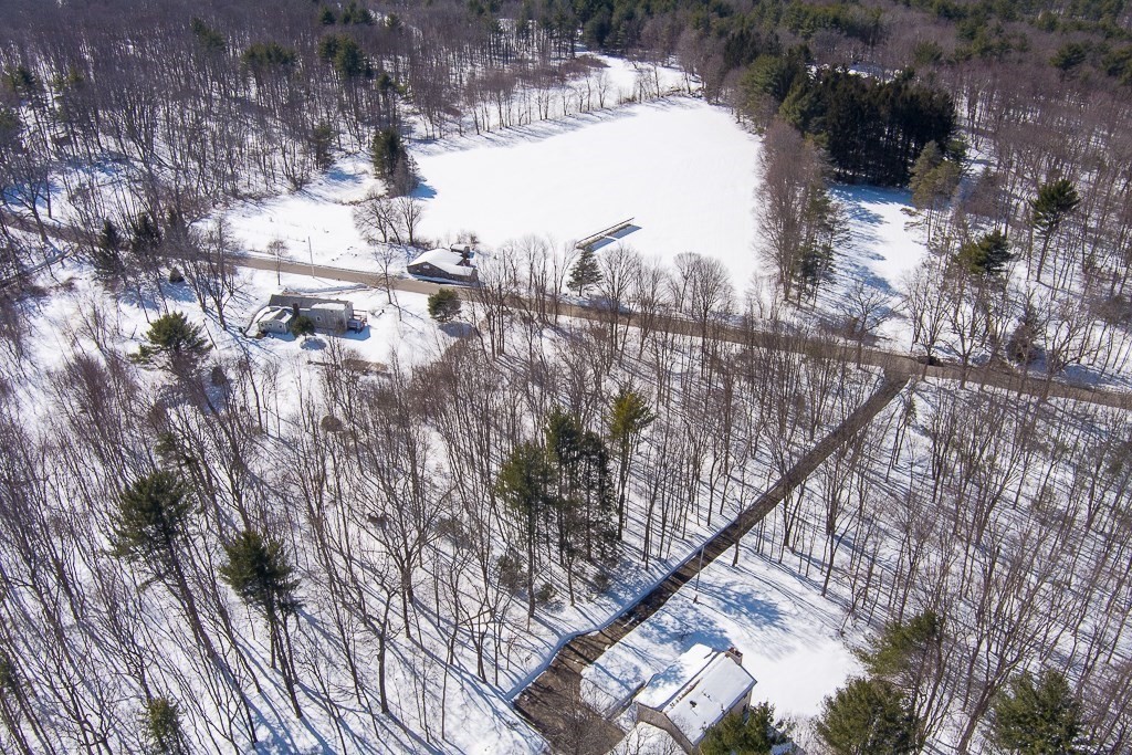 291 Wigwam Road West Brookfield, MA 01585 - Photo 2 of 9 a view of outdoor space with green space and fog