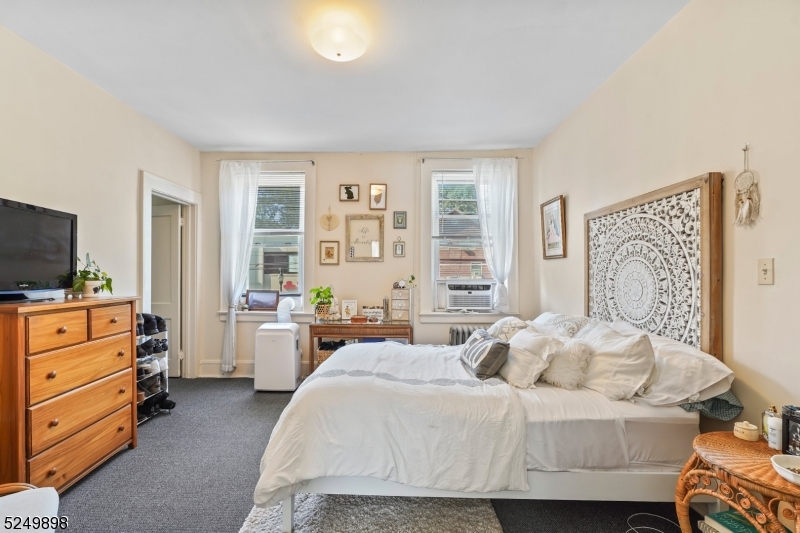 460 Bloomfield Avenue, Unit 3 Caldwell, NJ 07006 - Photo 5 of 8 a bedroom with a bed and a dresser
