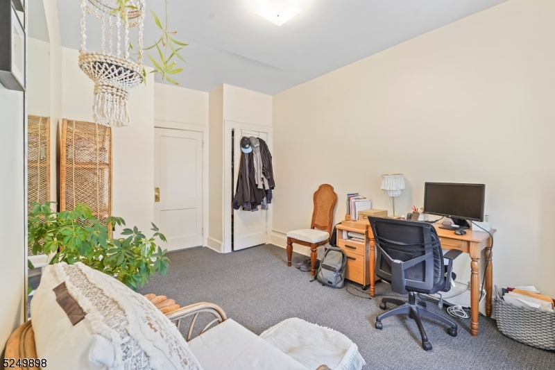 460 Bloomfield Avenue, Unit 3 Caldwell, NJ 07006 - Photo 6 of 8 a view of a workspace with furniture and a livingroom