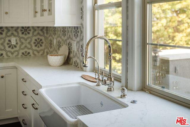 a kitchen with stainless steel appliances a refrigerator and a stove