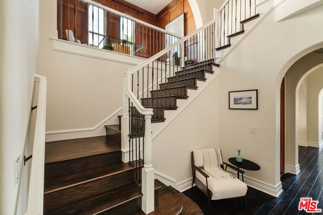 a white bench sitting next to a window