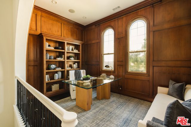 a view of a livingroom with furniture and staircase