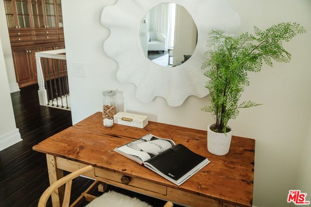a bedroom with a bed and a couch next to a window