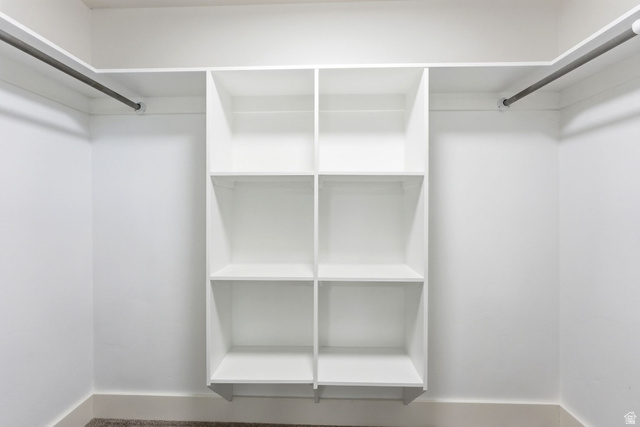 871 Bonita Way Centerville, UT 84014 - Photo 35 of 61 Integrated storage system with white shelving units, dual hanging rods, and neutral carpet flooring
