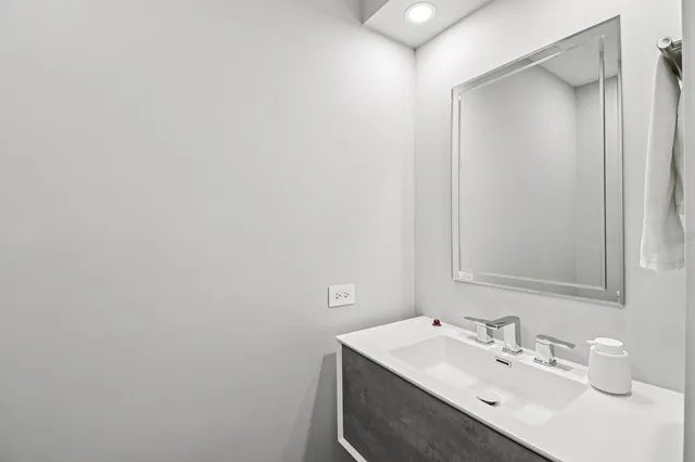 a spacious bedroom with a bed and a flat screen tv