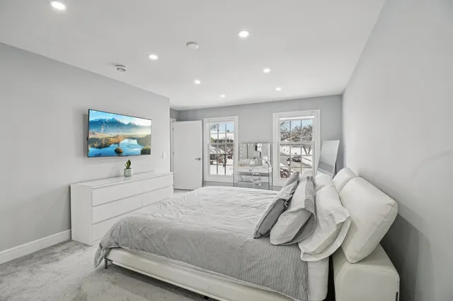 a bathroom with a sink a toilet and a shower