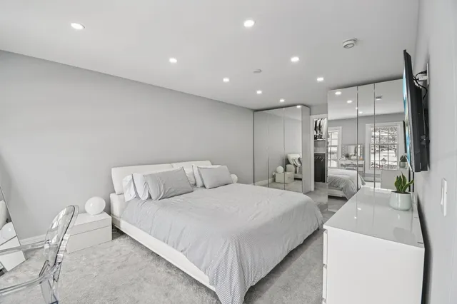 a bedroom with a bed and furniture