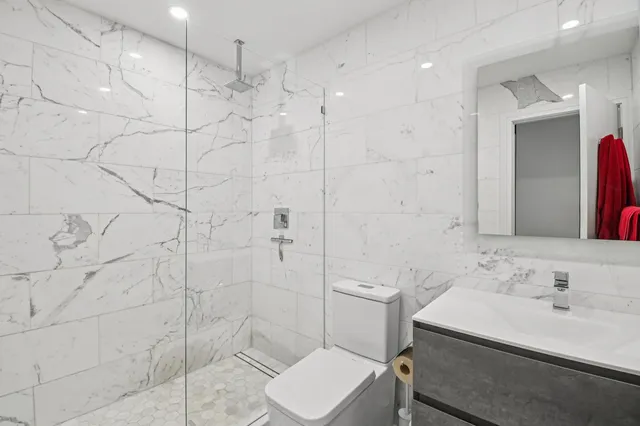 a bedroom with a bed and a lamp on table