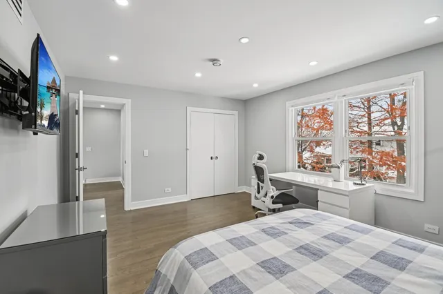 a bathroom with a sink toilet vanity and shower